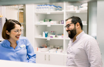 Doctor and staff talking and laughing together