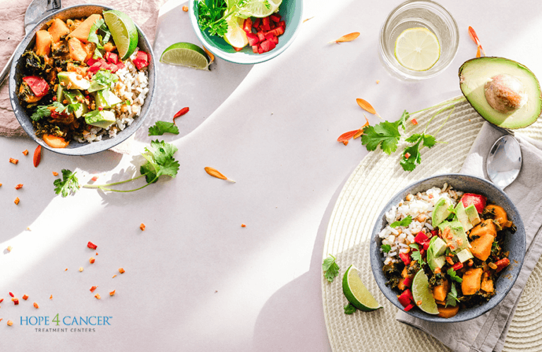 Organic food bowls on a table with avocados