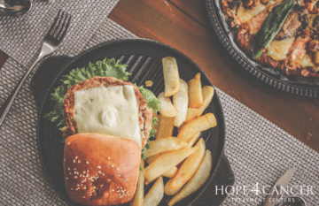 Hamburger and French fries on a plate